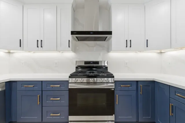 a kitchen with a refrigerator and a sink