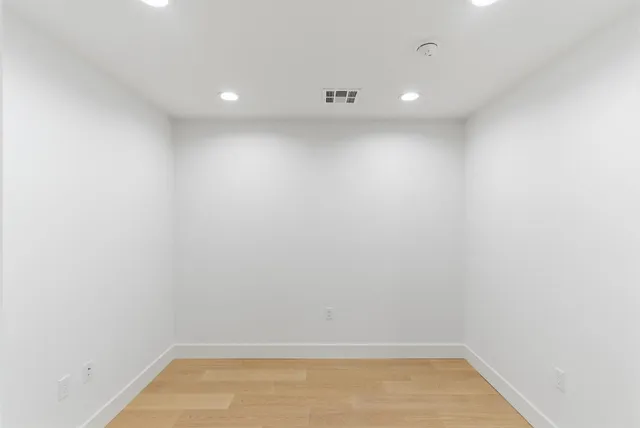 a kitchen with stainless steel appliances granite countertop a stove refrigerator and cabinets