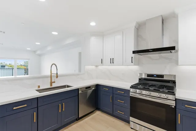 a kitchen with a sink and a window