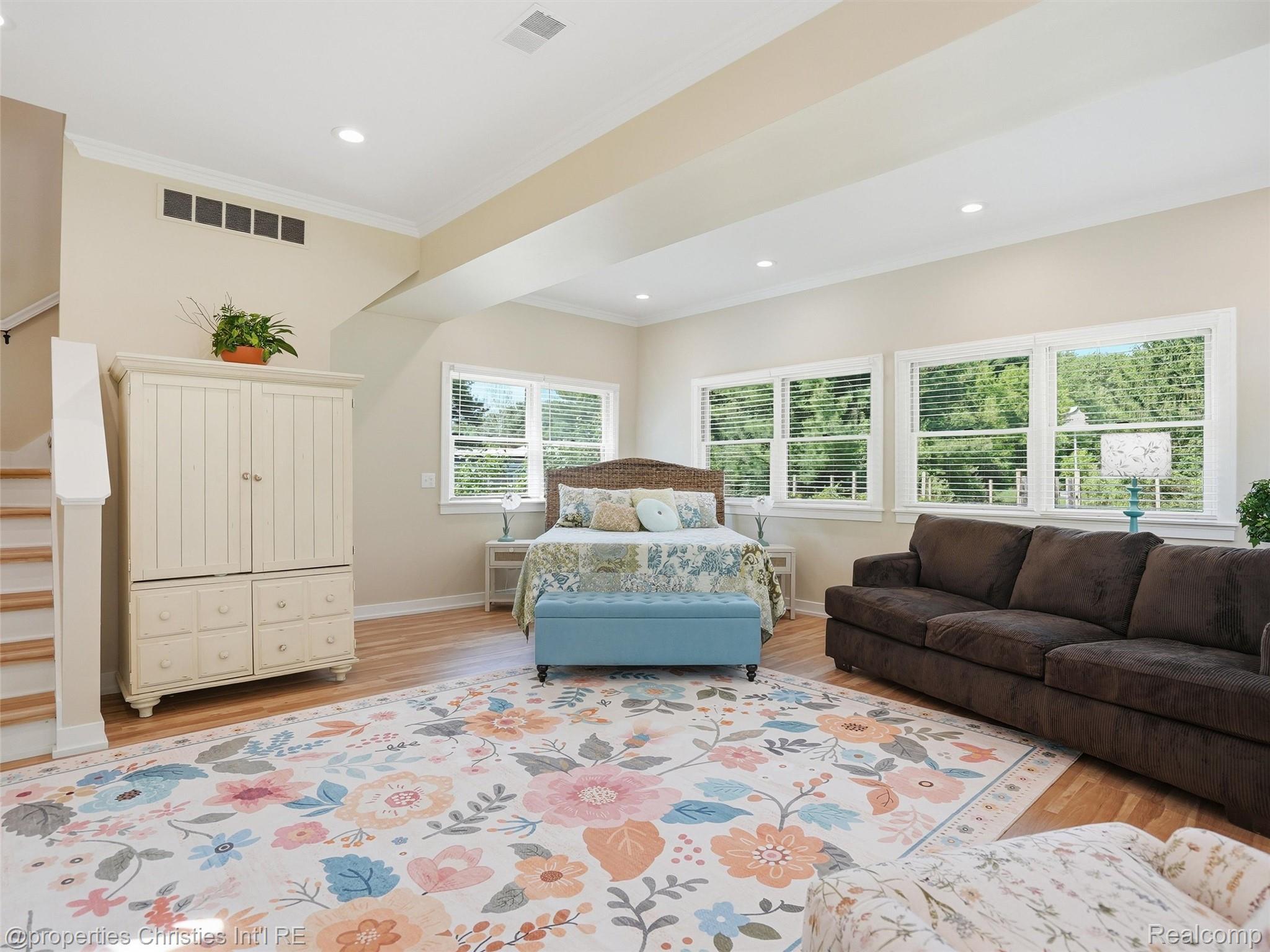 8645 Toma Road Pinckney, MI 48169 - Photo 24 of 65 Light filled primary bedroom with stairs to additional bedroom/loft space
