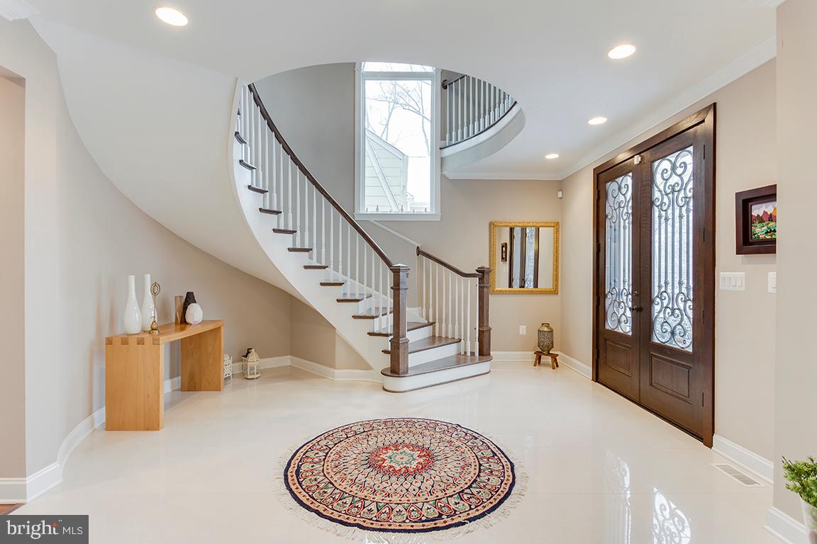 5618 Greentree Road Bethesda, MD 20817 - Photo 1 of 32 Gorgeous curved staircase in two story foyer