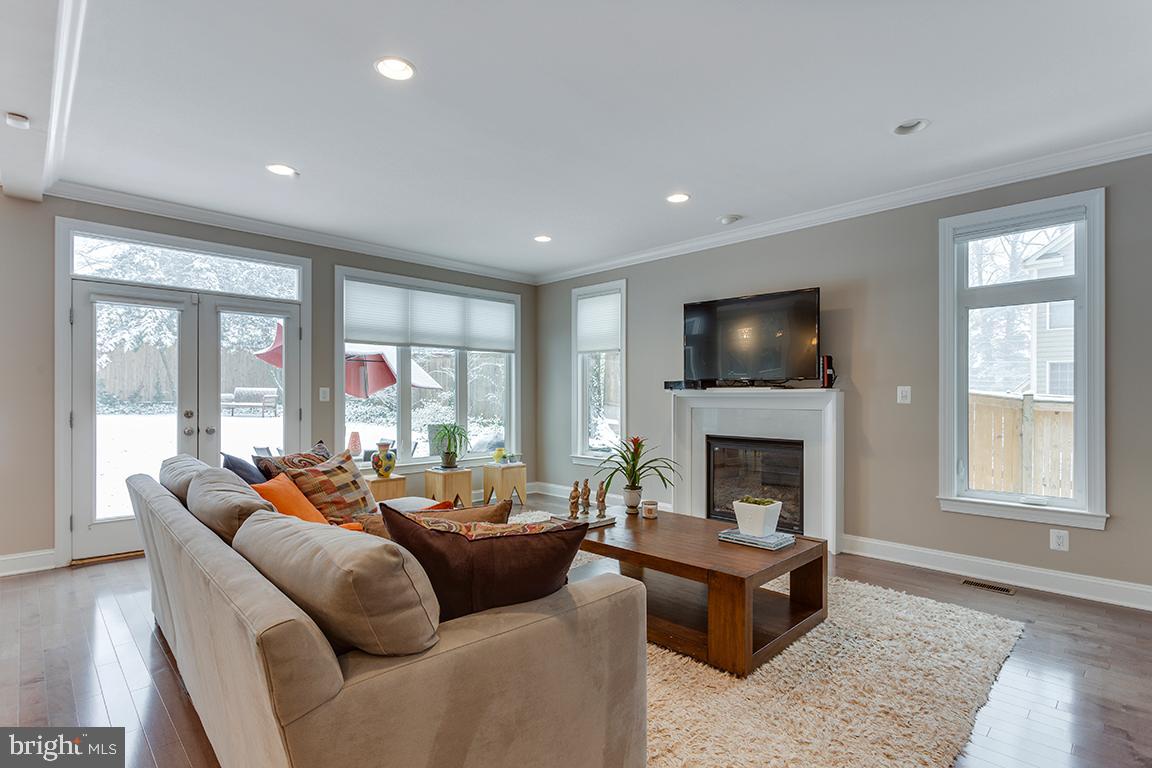 5618 Greentree Road Bethesda, MD 20817 - Photo 13 of 32 Family room w fireplace, opens to deck