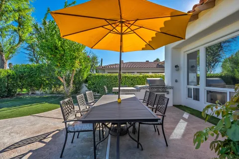 a view of an outdoor sitting area with furniture