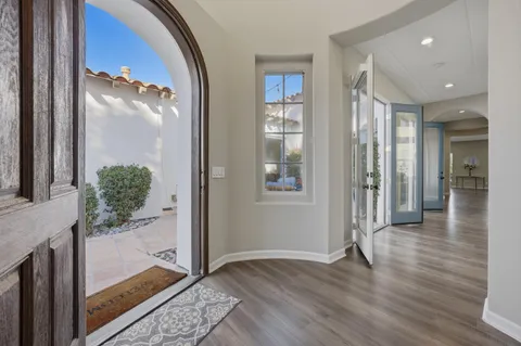a view of a dining room with furniture and a potted plant