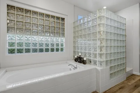 a kitchen with cabinets appliances and a window