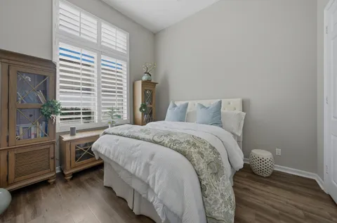 a bathroom with a toilet a sink and a mirror