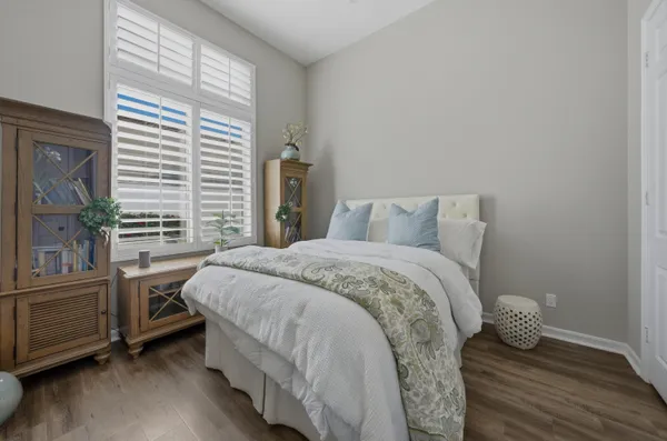 a bathroom with a toilet a sink and a mirror