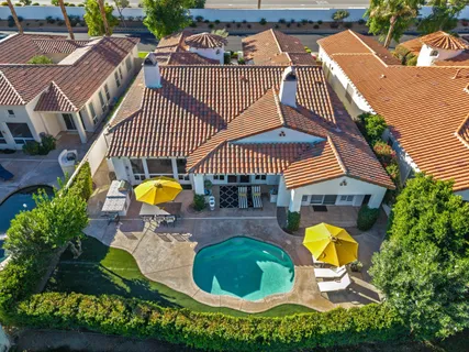 a view of a lush green hillside and houses