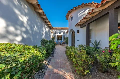 a view of a building with outdoor seating space