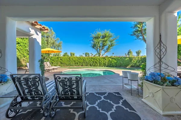 a view of a swimming pool with a yard