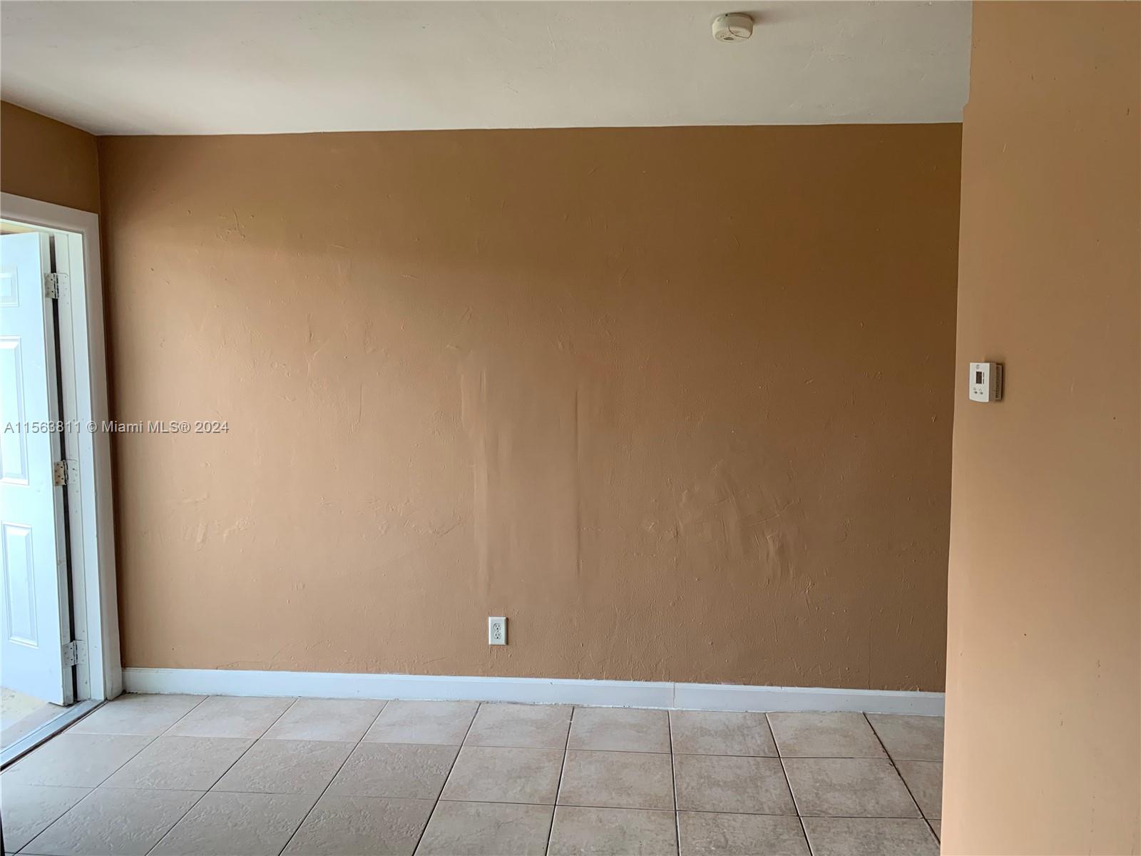 405 Northwest 5th Street, Unit 3 Pompano Beach, FL 33060 - Photo 6 of 6 a view of an empty room