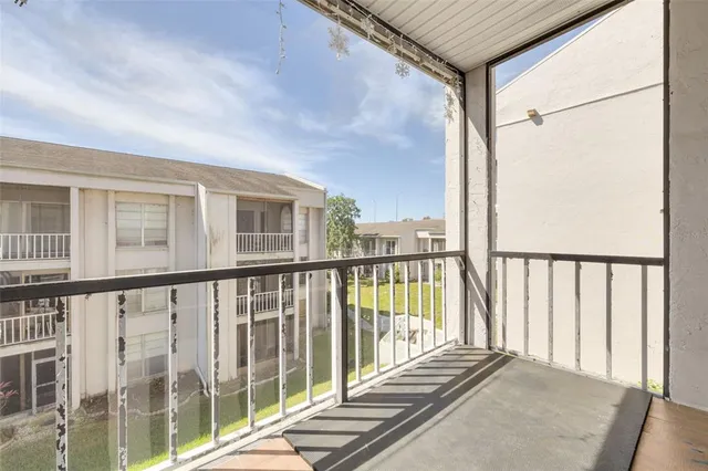 a picture of a bench in front of a wall