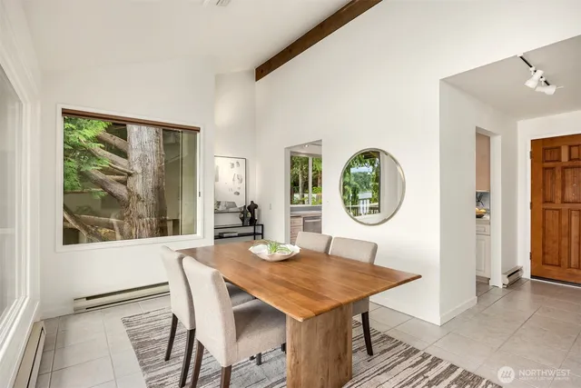 a view of a dining room with furniture and window