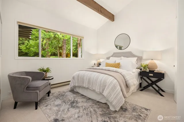 a bedroom with bed and a window