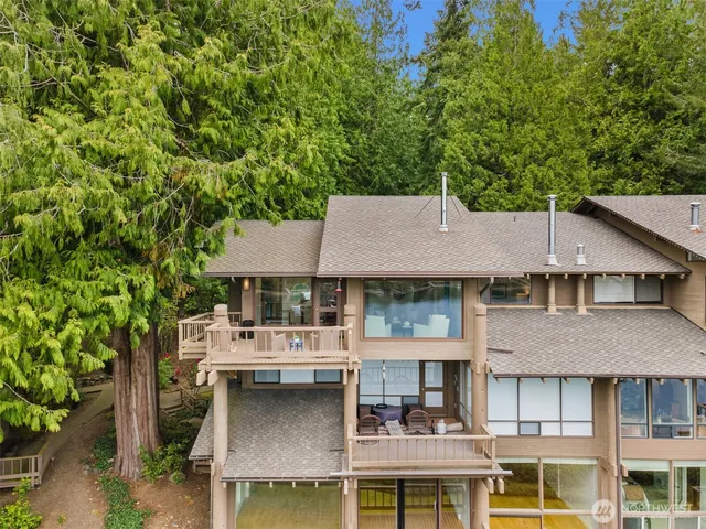 a aerial view of a house with swimming pool and sitting area
