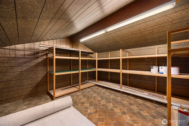 a view of an empty room with empty shelves