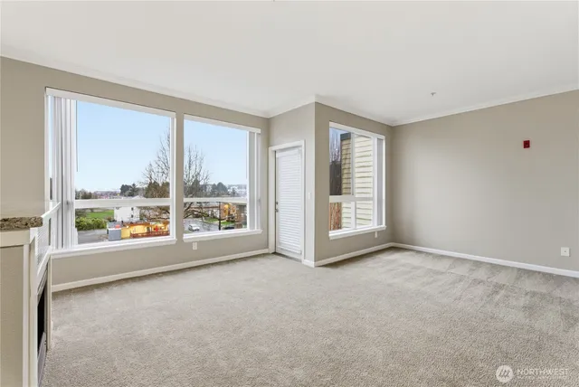 an empty room with windows and view