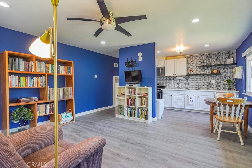 163 North Center Street Redlands, CA 92373 - Photo 13 of 37 a living room with furniture and a kitchen view