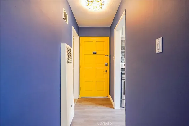 a view of a hallway with windows