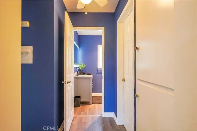 a view of a bathroom from a hallway