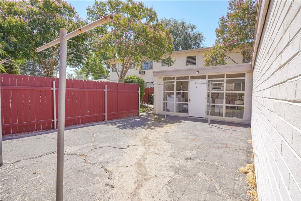 163 North Center Street Redlands, CA 92373 - Photo 32 of 37 a view of a house with a yard and garage