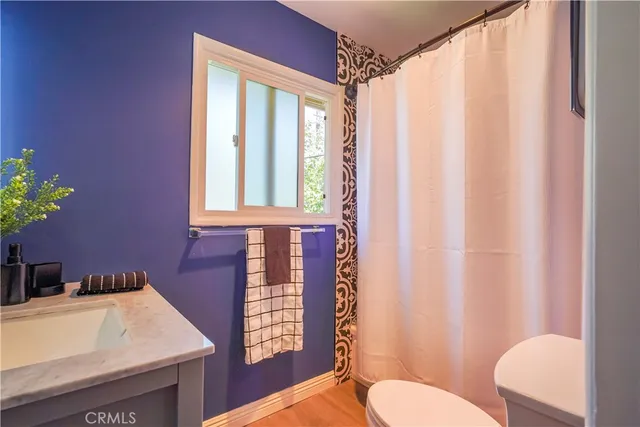 a bathroom with a sink toilet and tub