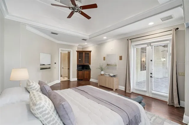 a bathroom with a granite countertop sink a toilet a mirror a bathtub and shower