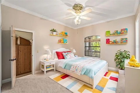 a bedroom with a bed furniture and a window