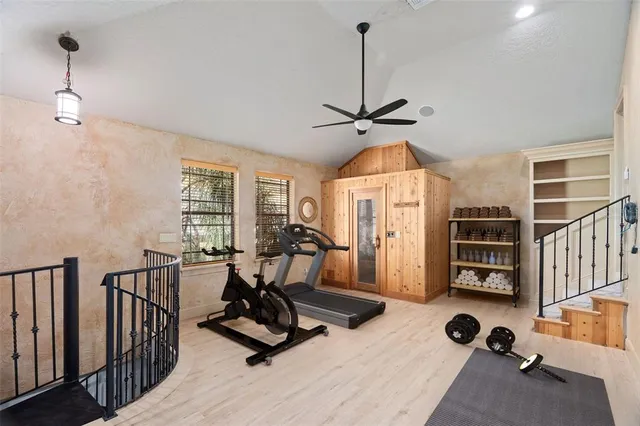 a view of a swimming pool and lounge chairs
