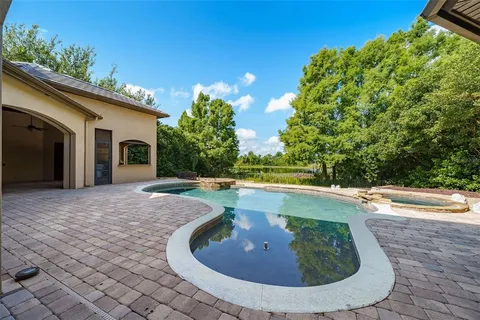 a view of a swimming pool with a sitting space