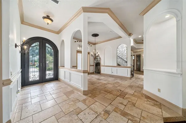 a view of a entrance and room with windows