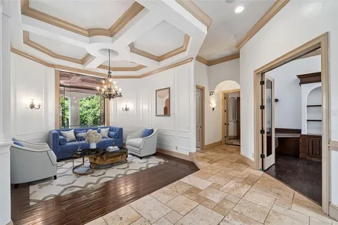 a living room with furniture a window and a table