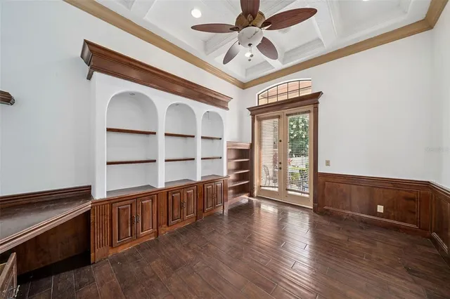 a kitchen with granite countertop a sink stove and refrigerator