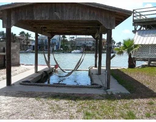 an empty room with windows and cabinet