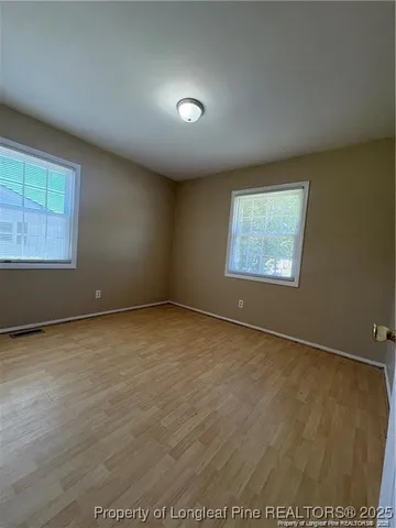 an empty room with windows