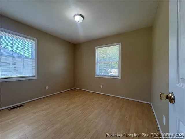 an empty room with a empty space and a window