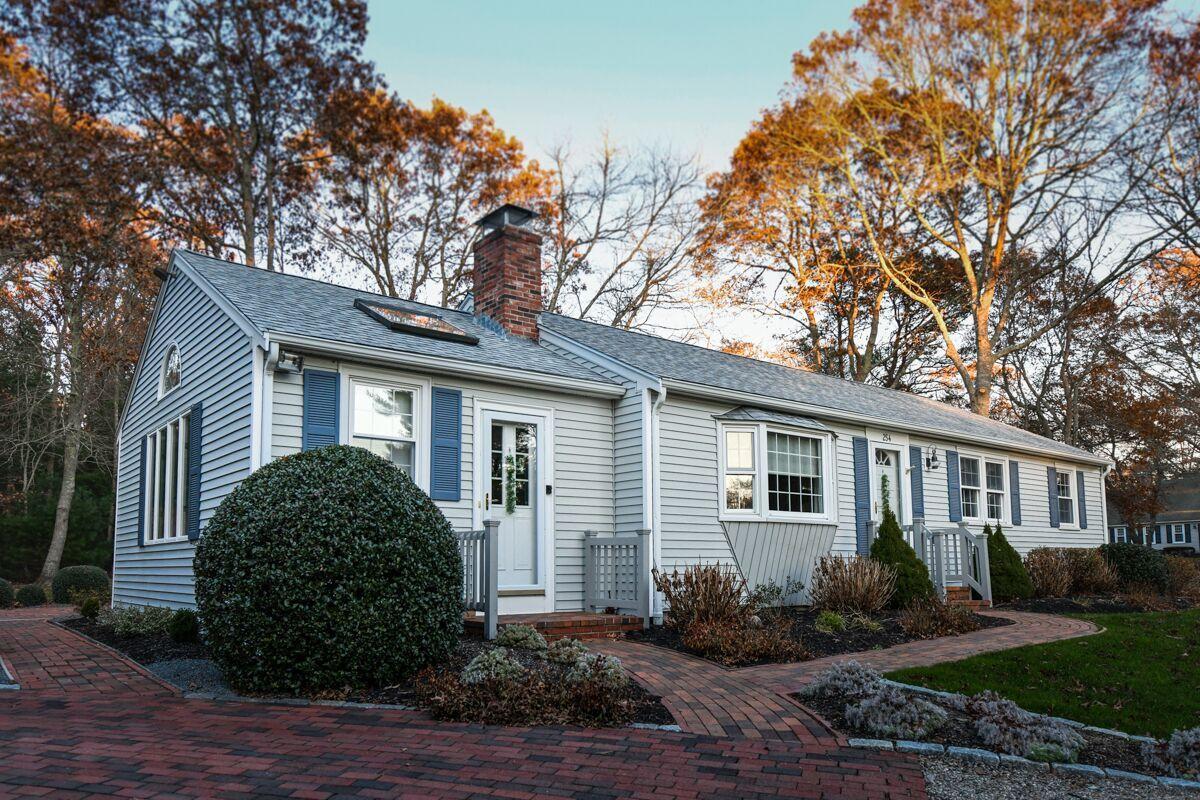a front view of a house with garden