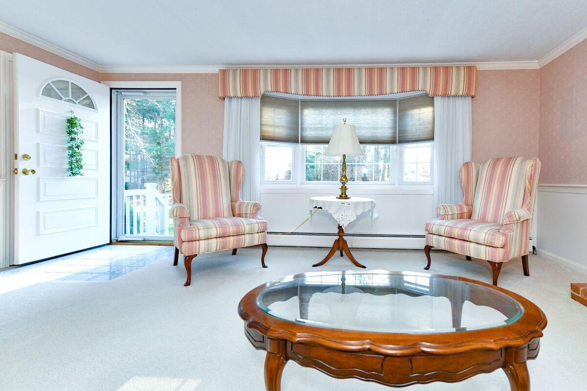 254 Cedric Road Centerville, MA 02632 - Photo 12 of 24 a living room with dining table and a large window