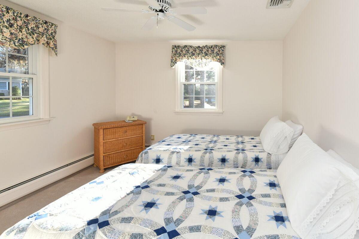 254 Cedric Road Centerville, MA 02632 - Photo 15 of 24 a bedroom with a bed and a window