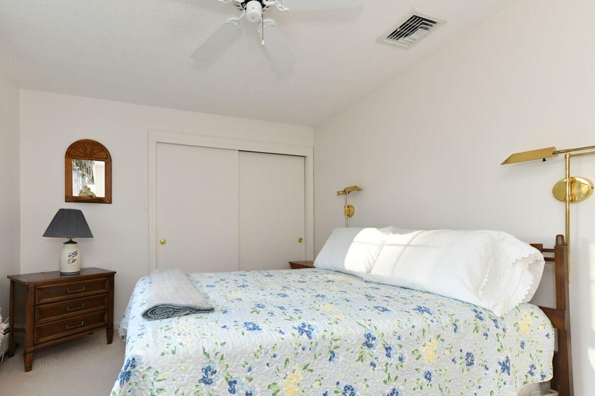 254 Cedric Road Centerville, MA 02632 - Photo 17 of 24 a bedroom with a bed and a lamp on the dresser