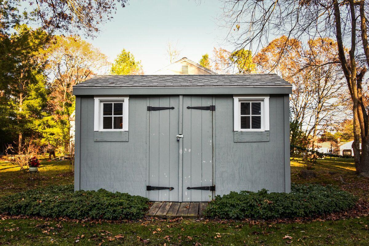 254 Cedric Road Centerville, MA 02632 - Photo 22 of 24 a view of a wooden house next to a yard