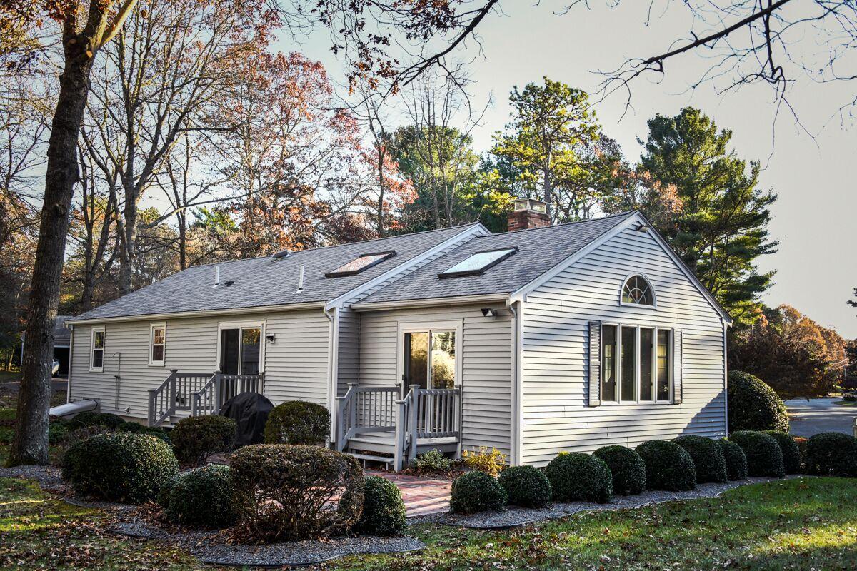 254 Cedric Road Centerville, MA 02632 - Photo 23 of 24 a front view of a house with a yard