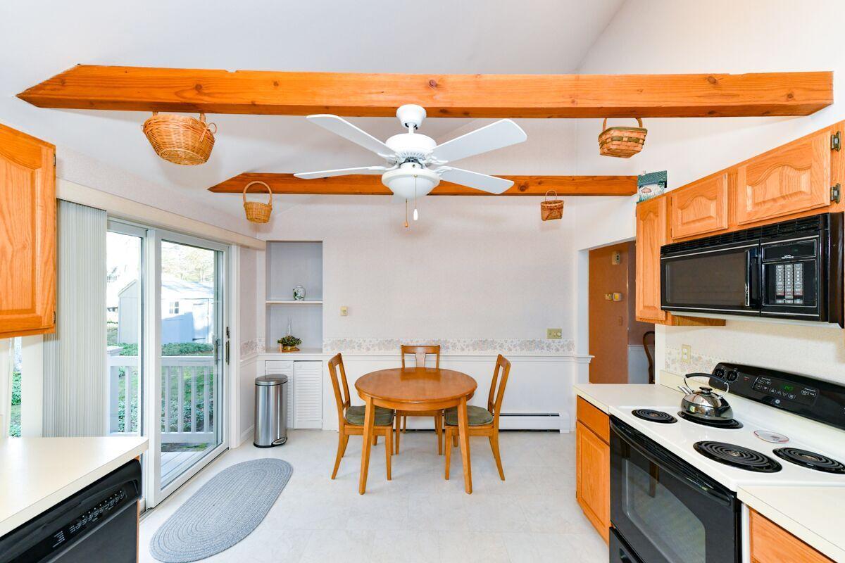 254 Cedric Road Centerville, MA 02632 - Photo 5 of 24 a dining room with furniture and a floor to ceiling window