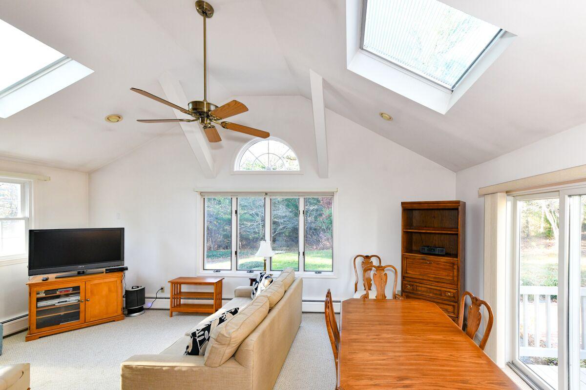 254 Cedric Road Centerville, MA 02632 - Photo 6 of 24 a living room with furniture and a flat screen tv