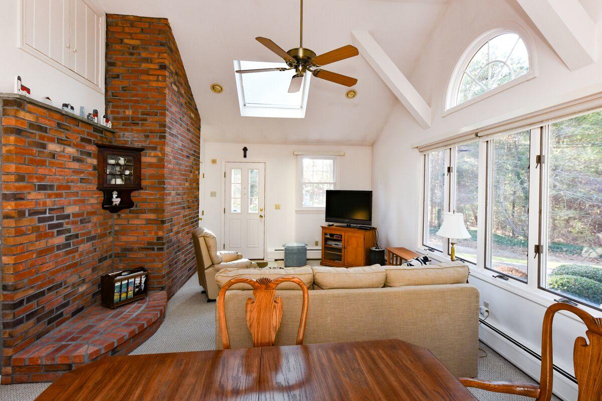 254 Cedric Road Centerville, MA 02632 - Photo 7 of 24 a living room with furniture and a flat screen tv