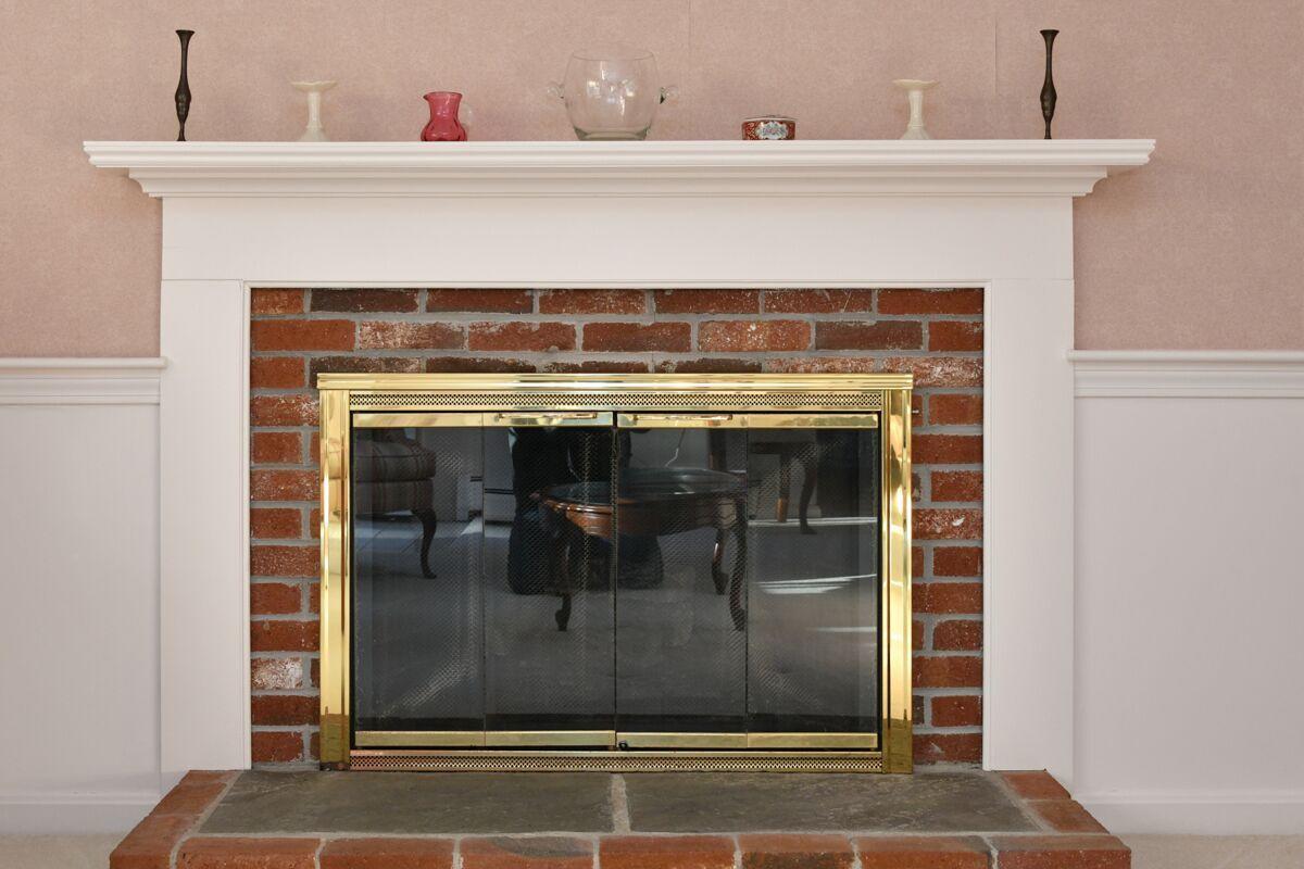 254 Cedric Road Centerville, MA 02632 - Photo 9 of 24 a close view of a fireplace in a room