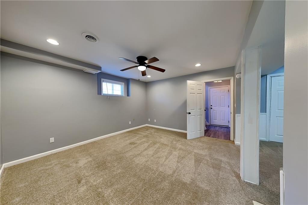 4304 Falcon Crest Drive Flowery Branch, GA 30542 - Photo 16 of 21 a view of a livingroom with a ceiling fan