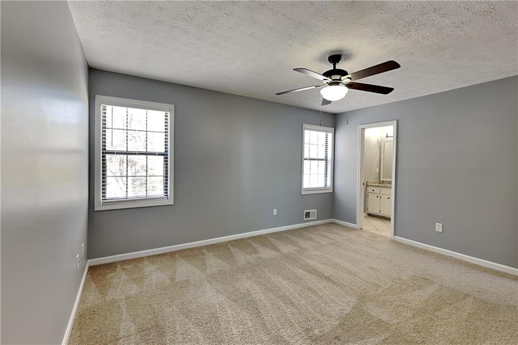 4304 Falcon Crest Drive Flowery Branch, GA 30542 - Photo 6 of 21 a view of an empty room with a window