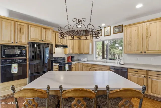 a dinning table and chairs in the kitchen