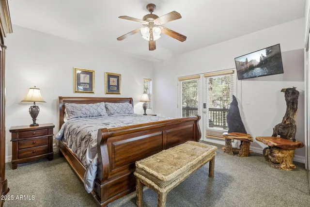 a bedroom with bed and a window